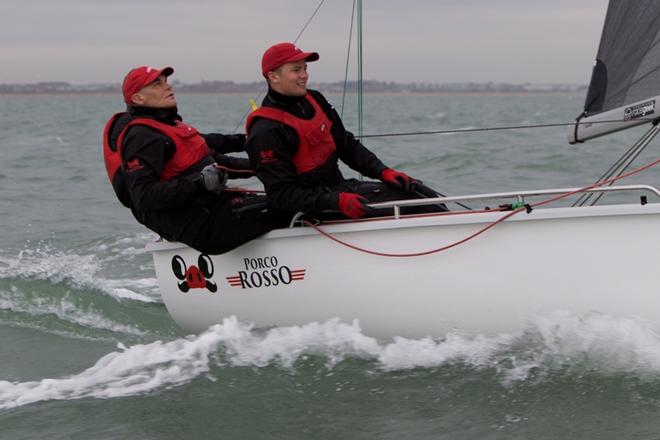 Day 3 – Owner Paul McCartney on main and forward hand Edward Snowball on the rail of Porco Rosso. Helmsman is Elliott Noye – SB20 World Championship ©  Jennifer Burgis